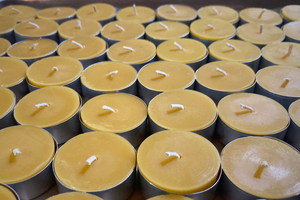 a closeup photo of a grouping of tea light candles