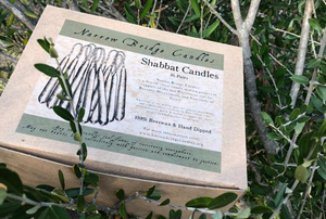 A box of candles sits in a tree